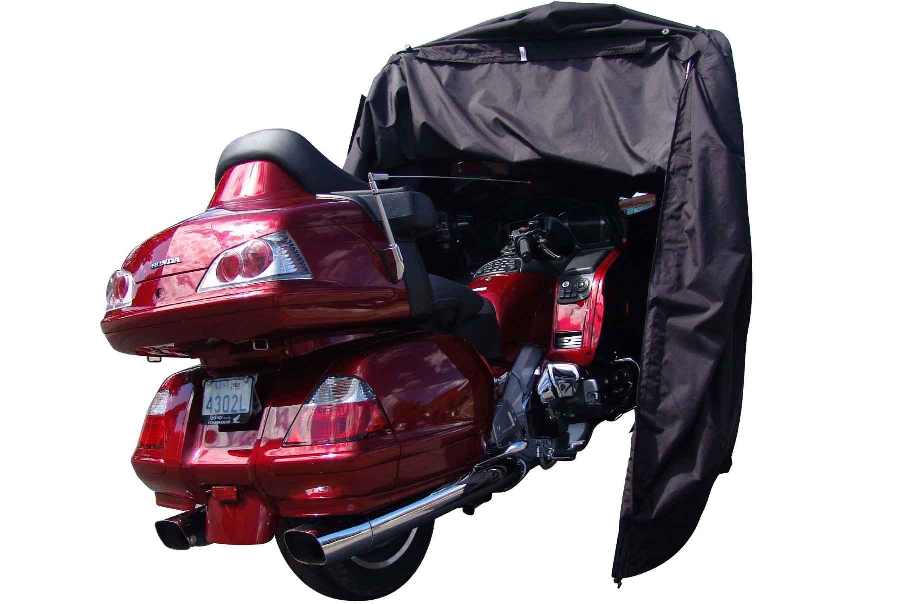 Touring motorcycle inside pro shelter garage