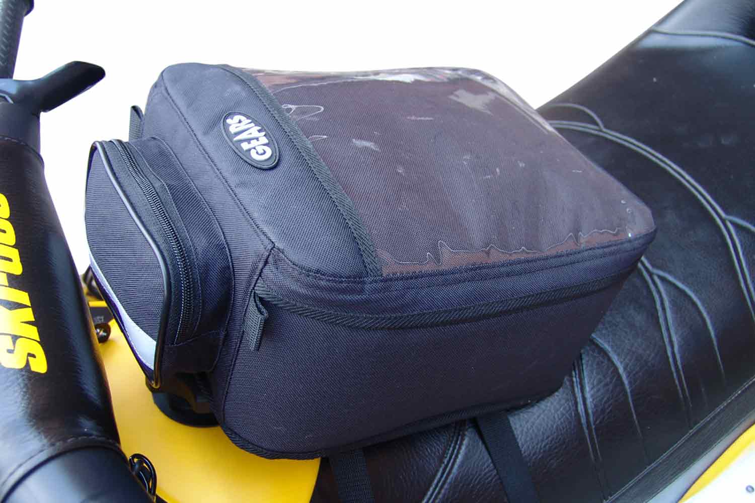 Black tank bag on snowmobile 