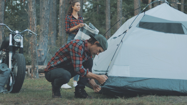Setting up tent during camping
