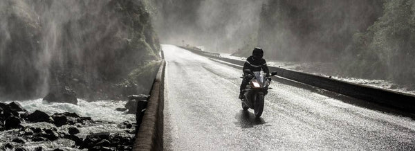 motorcycling in rain wearing rain suit