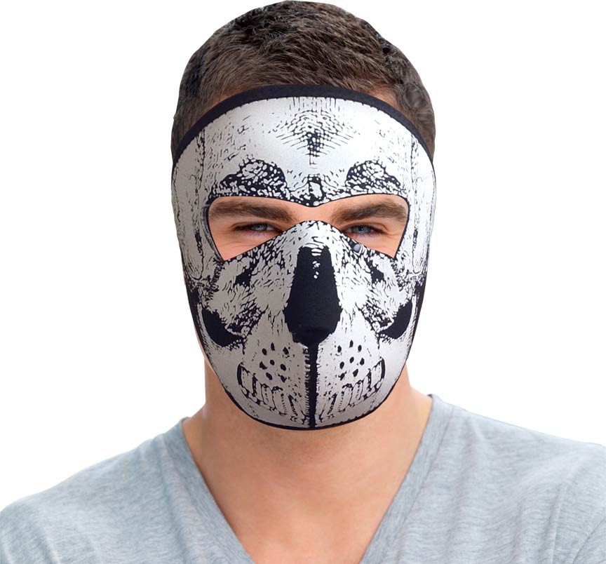 Man wearing full-face reversible skull mask